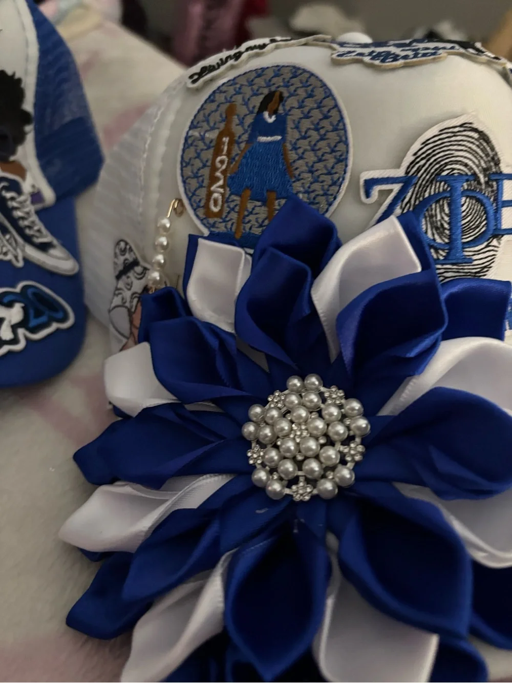 White Hat with Blue & White Flower Appliqué